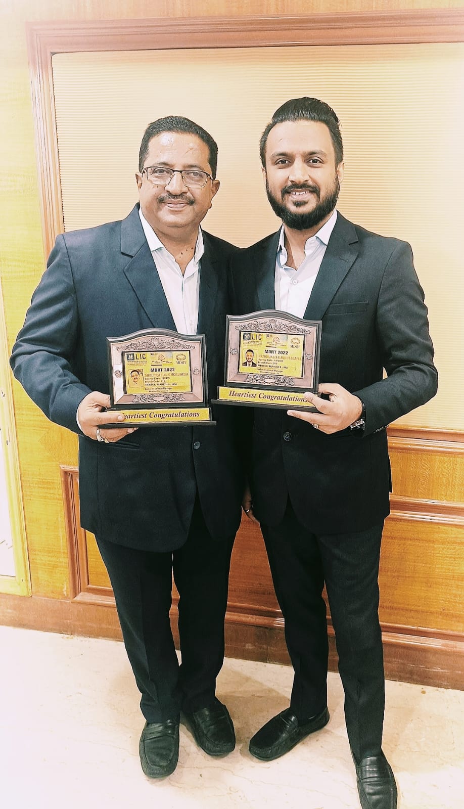 Praful and Darshit Morjaria with their MDRT awards